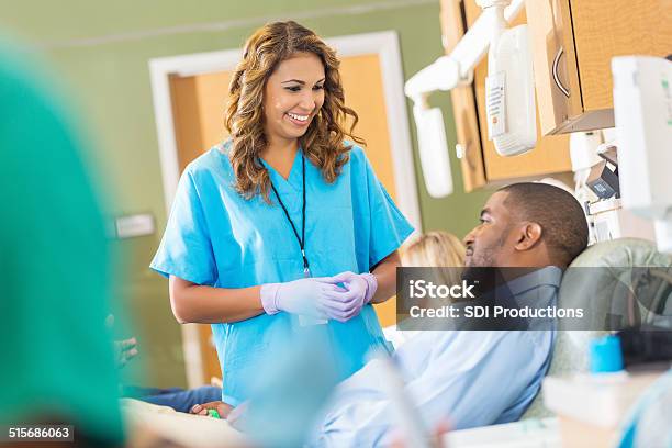 Friendly Nurse Helping Patient In Hospital Blood Bank Center Stock Photo - Download Image Now