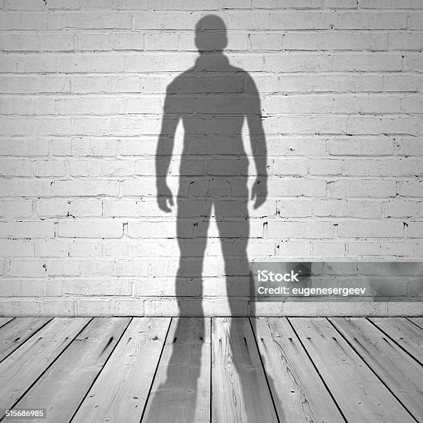 Shadow Of A Man On White Brick Wall Stock Photo - Download Image Now - Shadow, Wall - Building Feature, Rear View