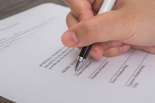 istock Close up of hand completing an employment application form 515687531