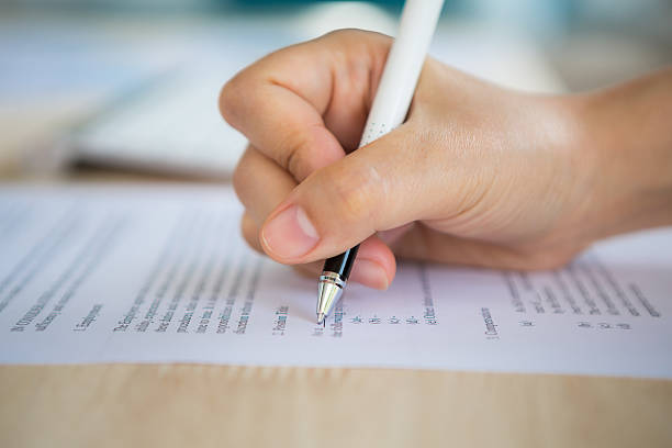 istock Close up of hand completing an employment application form 515687545