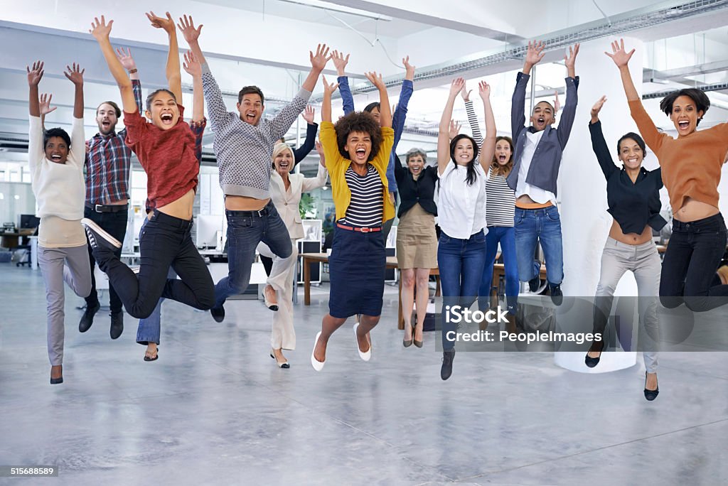 They'll jump at the chance to help you out Shot of office staff jumping Celebration Stock Photo