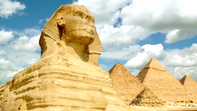 Timelapse of famous Sphinx with great pyramids in Giza valley
