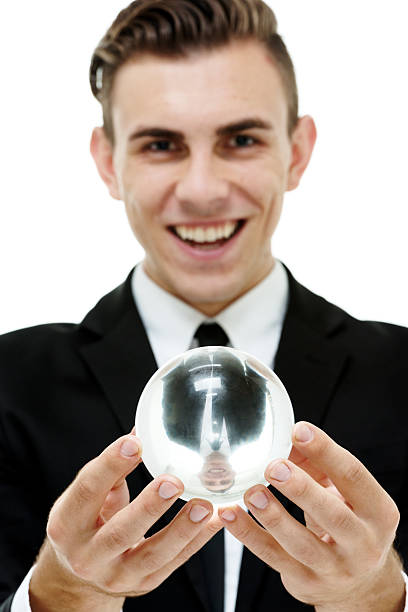 istock Cheerful businessman holding crystal ball 515688887