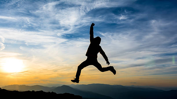 istock celebrating success in the sunset 515701029