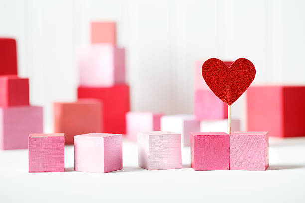 istock Red and pink wooden blocks with small heart 515701948