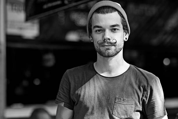 portrait of waiter with styled moustaches
