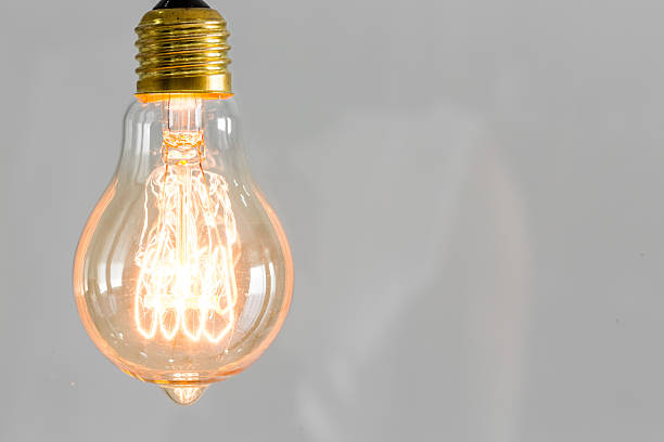 istock Close up of vintage glowing light bulb 515703299
