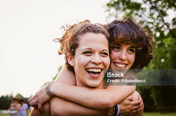 Young Couple At The Park Stock Photo - Download Image Now - Gay Couple, Gay Person, Adolescence