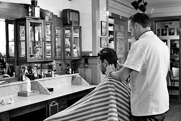 istock barber working with customer at barbershop 515704337
