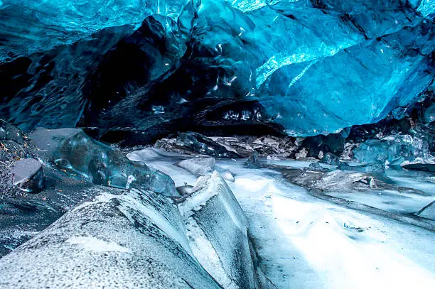 This photography was taken in January 2016, at the Langjokull Glacier, in the Eastern Part of Iceland. One of the largest glaciers in the world, it extends itself many kilometers beyond the horizon. During the coldest months of the winter, it is possible to go inside the caves formed by ice and experience beautiful formations made of ice. The daylight reflects on the ice and everything becomes blue.