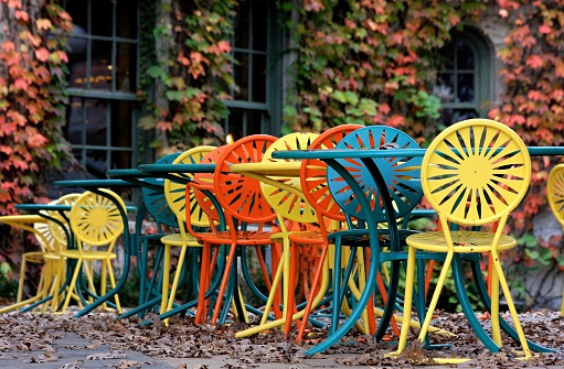 Colorful chairs on an autumn terrace