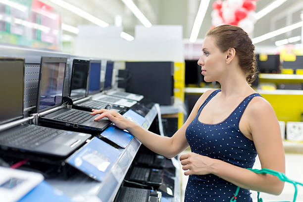 istock woman buying a laptop 515705345