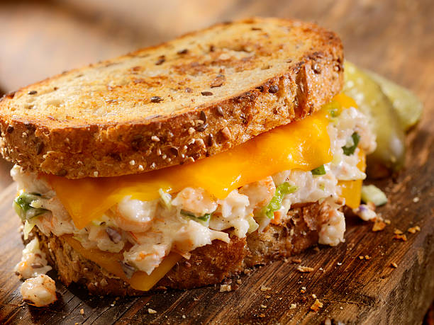 Grilled Cheese Seafood Salad Sandwich Grilled Cheese Seafood Salad Sandwich with Shrimp and Lobster-Photographed on Hasselblad H3D2-39mb Camera melting tuna cheese toast stock pictures, royalty-free photos & images