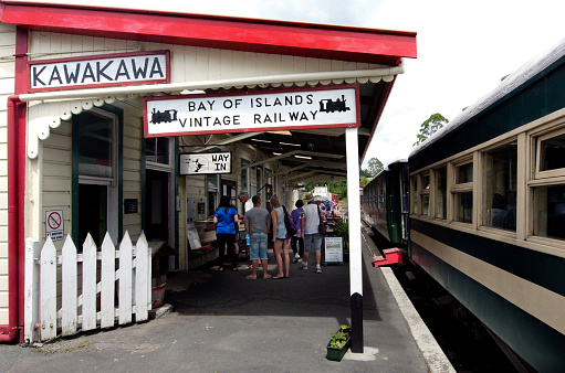Kawakawa, New Zealand - January 11, 2014: Passengers wait to board a train at Kawakawa train station on January 11, 2014. The railway at Kawakawa was the first railway to be opened and the first to run a rail passenger service in the North Island.