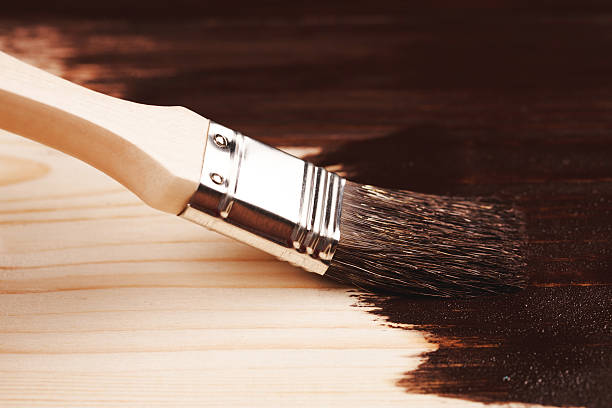 istock Painting wood with paint brush 515707332