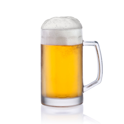 Light beer in frozen glass isolated on white