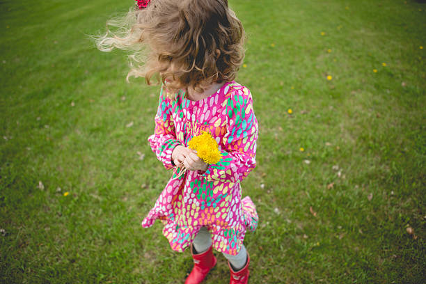istock windy girl with flowers 515708109