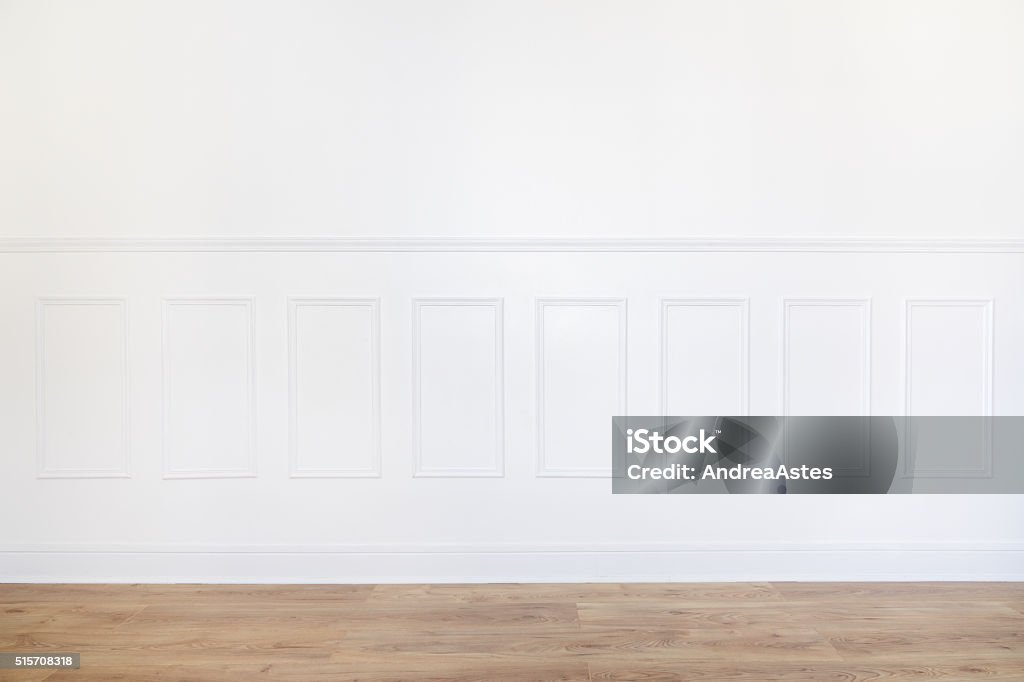 Empty white room with parquet floor and wood trimmed wall Empty white room interior with parquet floor and wood trimmed wall White Color Stock Photo