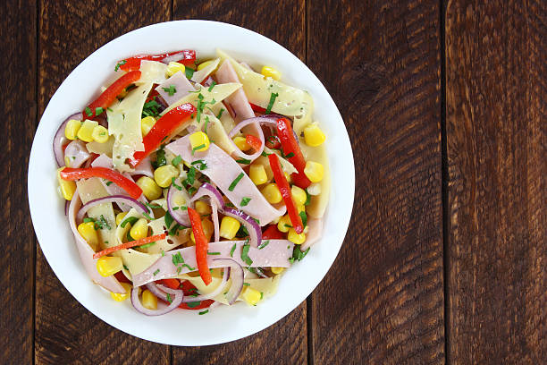 istock Salad with ham, paprika, corn,cheese and red onion 515711244