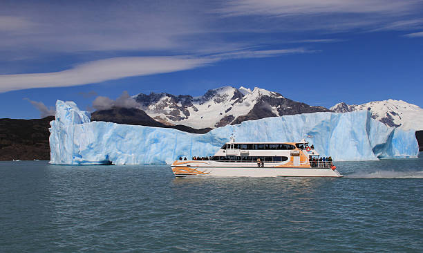 istock Ship and an iceberg in the background. 515716068