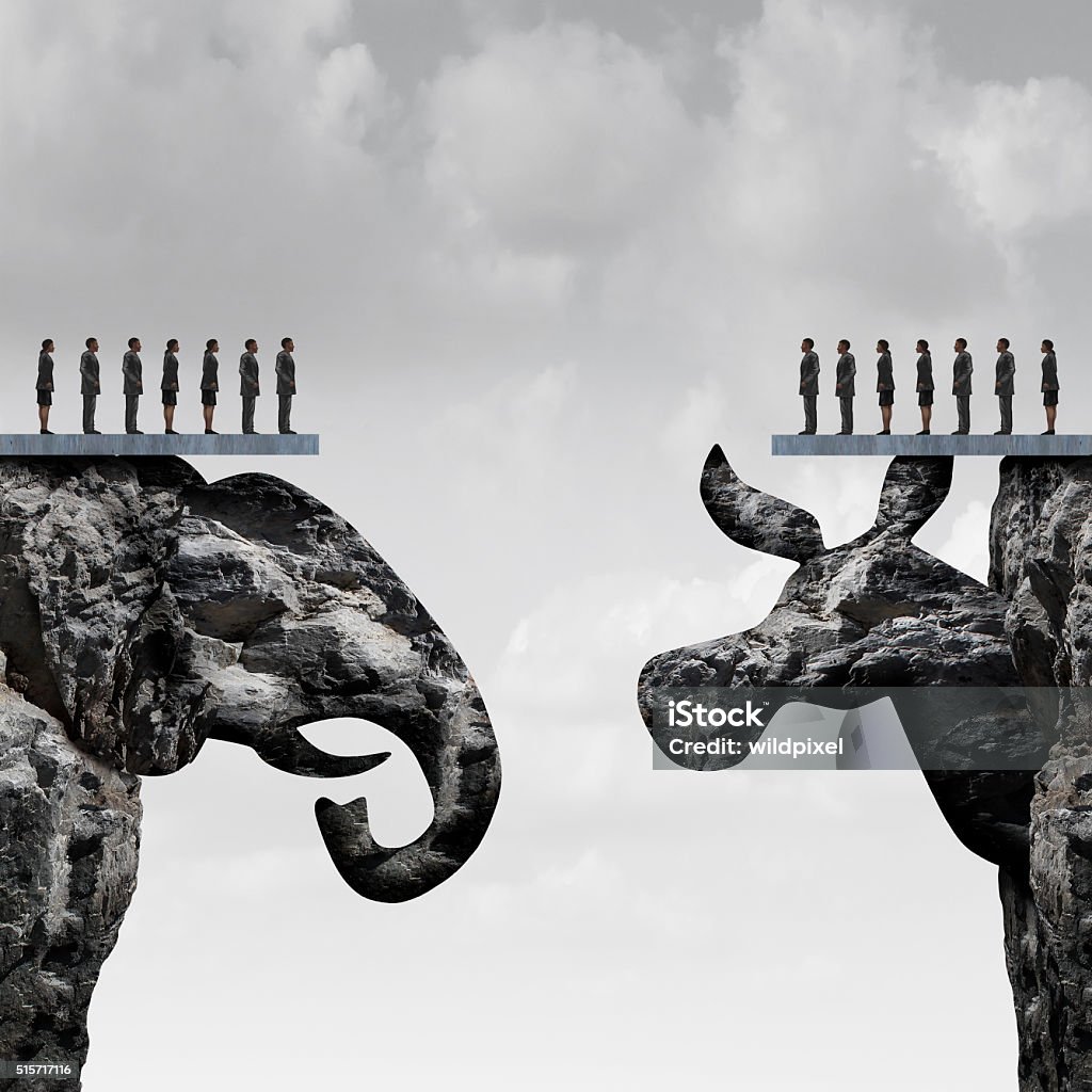 Republican Democrat Republican democrat political division concept and American election fight as as two mountain cliff sculptures shaped as an elephant and donkey symbol fighting for the vote of the United states presidential and government seats. Separation Stock Photo