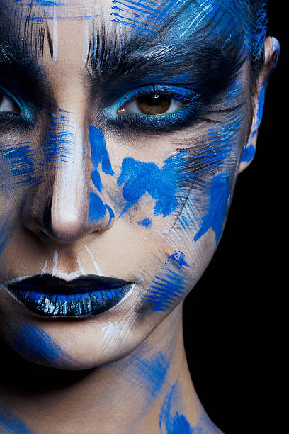 istock girl in blue paint on his face 515717134