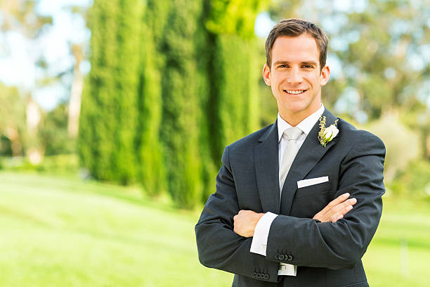 istock Groom Standing Arms Crossed In Garden 515718165