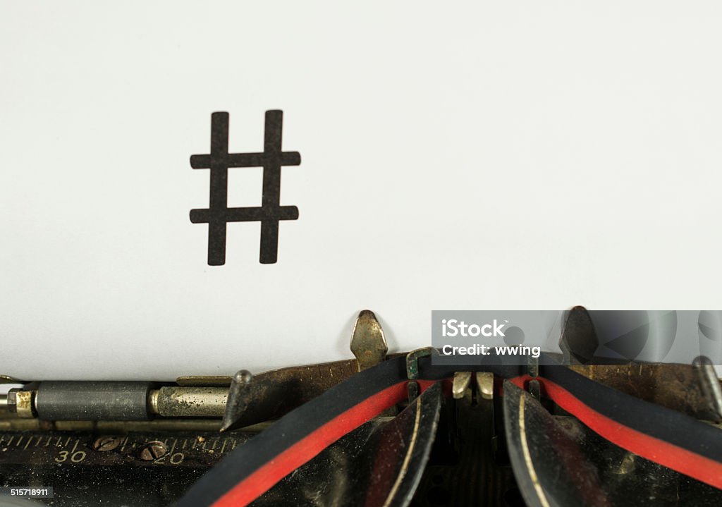 Old Typewriter with Hashtag An antique typewriter with the hashtag symbol. Close-up Antique Stock Photo