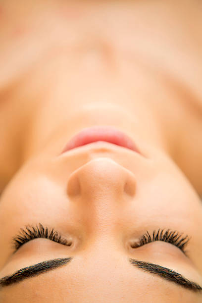 istock Pretty young woman relaxing in the spa 515720271