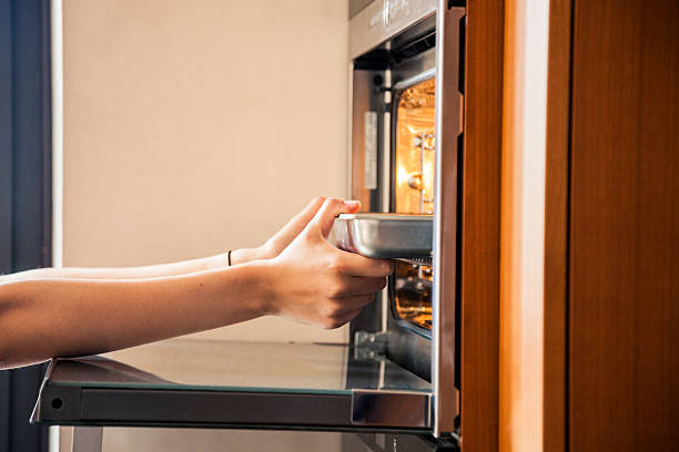 istock Woman preparing food on stove 515722265