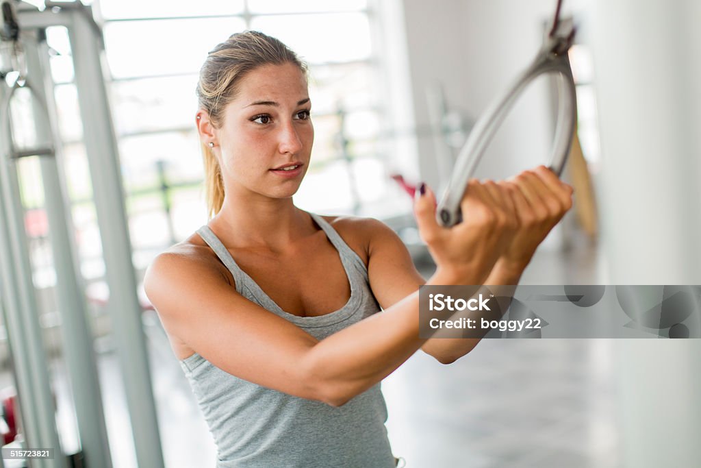 Young woman training in the gym Pretty young woman training in the gym Active Lifestyle Stock Photo