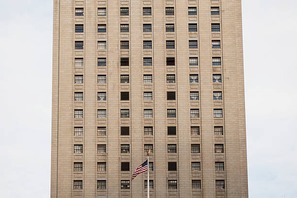 Old high rise building American flag in front