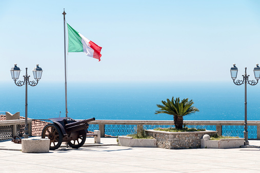 Ancient cannon in Italy with italy flag