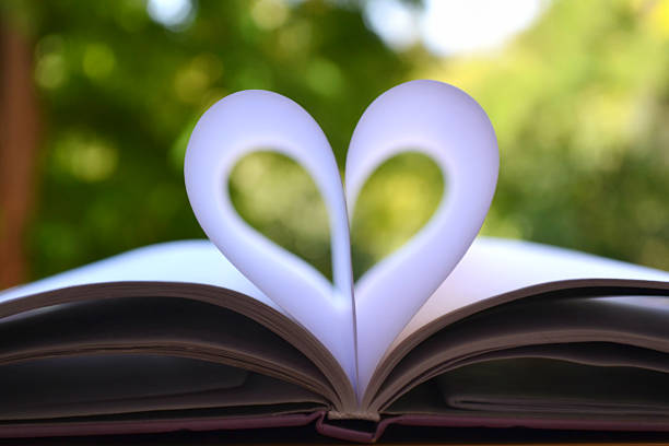 istock Book pages curved into a shape of heart 515725375