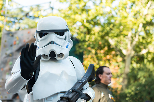 Madrid, Spain - September 20, 2014: A stormtrooper marches during the Training Day VI - 501st Spanish Garrison in Madrid, a yearly parade organized by an altruistic group in Spain. Black and white.