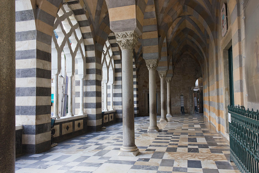 Amalfi, Italy, August 11, 2014: Amalfi Cathedral  (it.Duomo di Amalfi), external colonnade. The church is dedicated to the Apostle Saint Andrew. Predominantly of Arab-Norman Romanesque architectural style