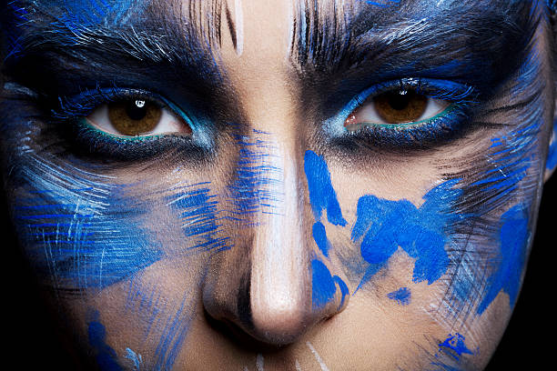 istock girl in blue paint on his face 515736162