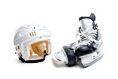 Ice Hockey Helmet and Skates Isolated on White