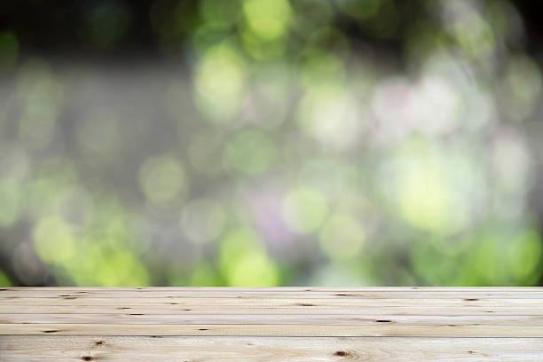 istock Wood table top on abstract colorful bokeh background 515737520