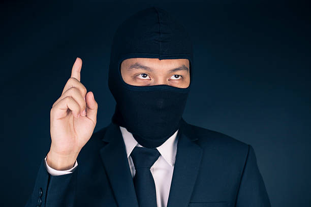 istock Businessman Wearing a Balaclava Thinking Corruption Plan 515737970