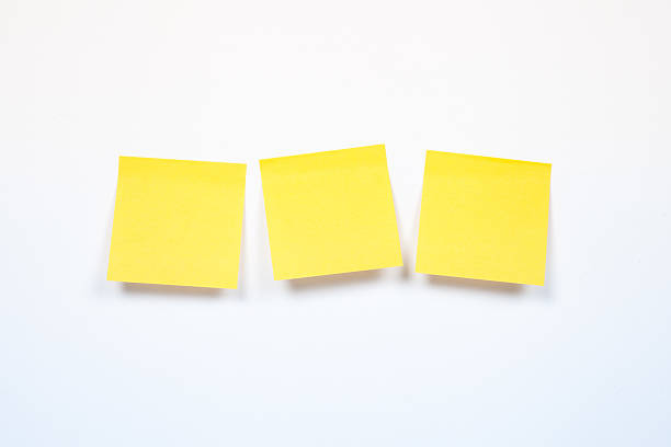 istock three yellow sticker on a white background, blank yellow adhesiv 515738036
