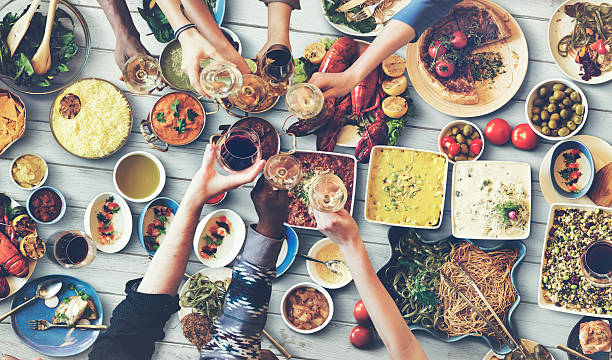 istock Friends Happiness Enjoying Dinning Eating Concept 515741052