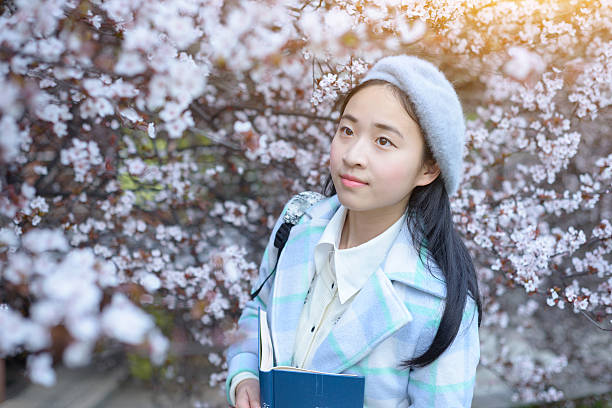 istock Japanese university students walking in the park 515741196