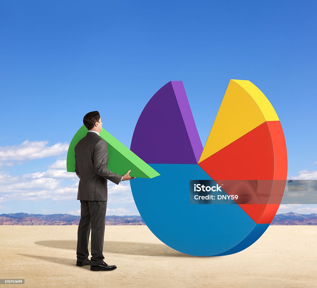 The Missing Piece Of The Pie A businessman holding the missing piece of the pie chart. Absence Stock Photo