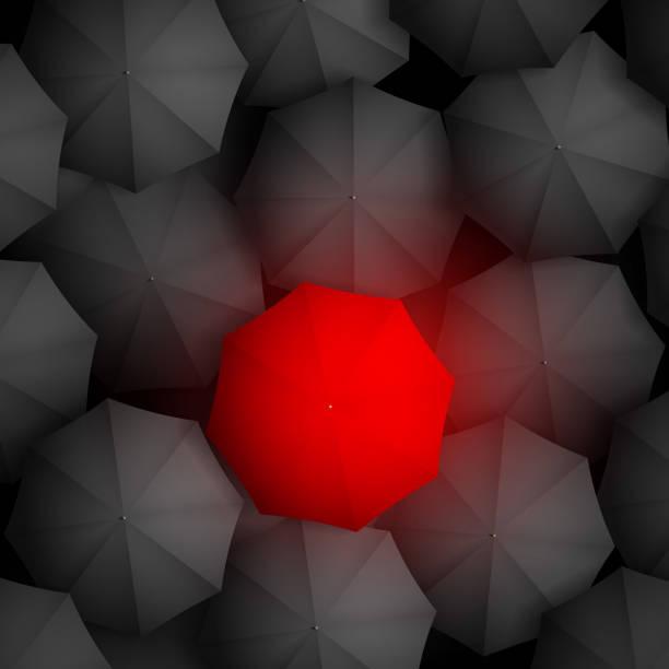 istock red umbrella on a background of black umbrellas 515742113