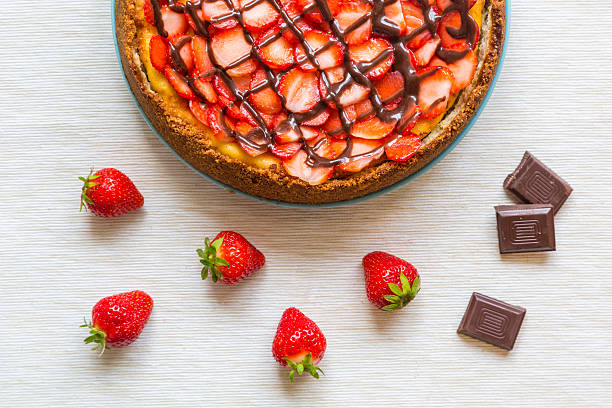 istock New York Cheesecake with Chocolate and Strawberries 515742735