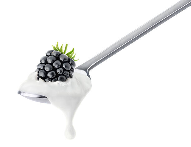 istock Spoon of blackberry yogurt 515742839