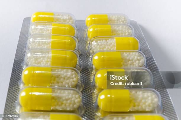 Yellow Pills Stock Photo - Download Image Now - Addiction, Blister Pack, Capsule - Medicine