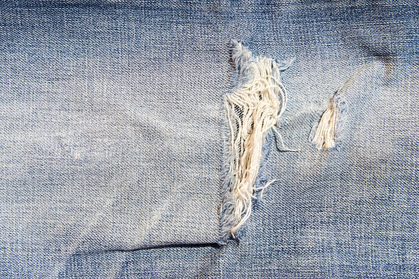 istock Macro shot part of the jeans that a bit torn 515743511