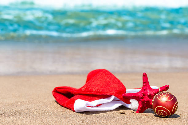 istock Christmas attributes and starfish on the beach 515743817